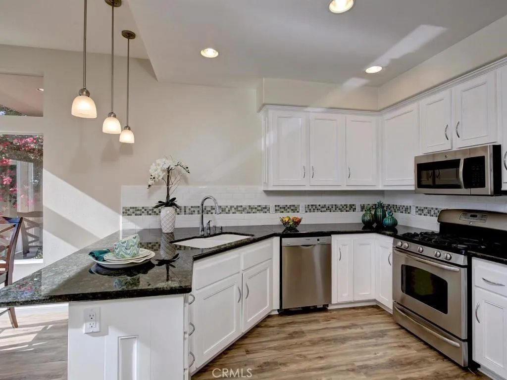 Granite counters and stainless steel appliances.