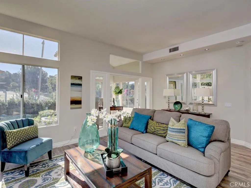 Great room living area opens to the sunroom and kitchen.