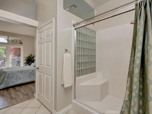 Primary shower with private toilet area
