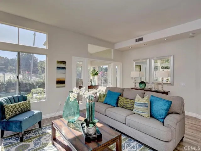 Great room living area opens to the sunroom and kitchen.