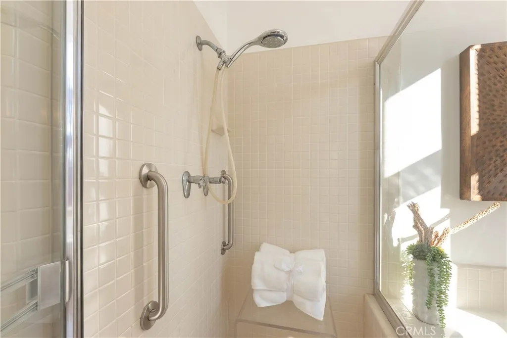 Safety grab bars installed in the Primary walk in shower