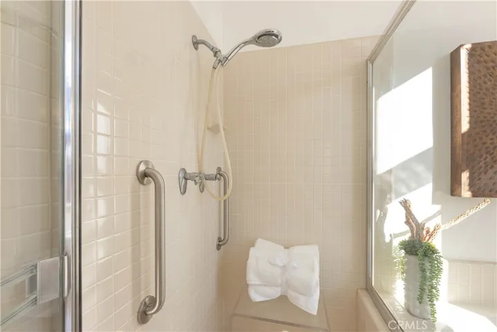 Safety grab bars installed in the Primary walk in shower