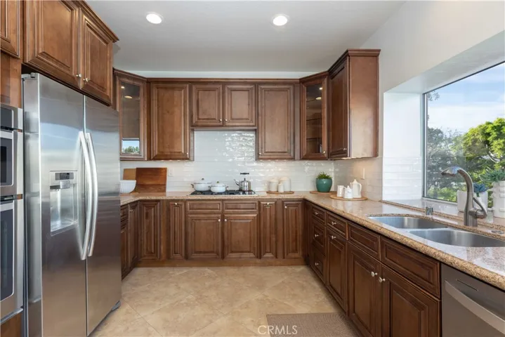 Loads of counter space and a picture window over the sink for soaking in the views, quality stainless appliances stay!