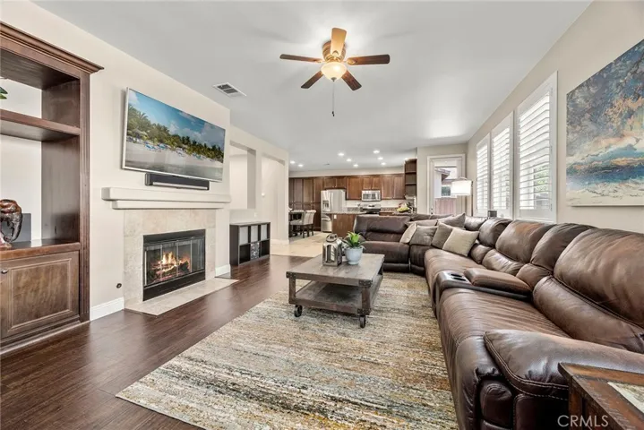 FIREPLACE WITH BUILT INS. LOOKING TOWARDS THE KITCHEN