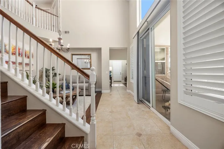 LOOKING FROM THE KITCHEN TOWARDS THE FRONT ENTRY
