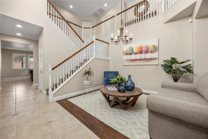 FORMAL DINING AREA CURRENTLY BEING USED AS A SITTING ROOM FOR GUESTS.