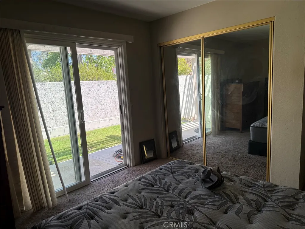 Second bedroom with sliding door to backyard. Second bedroom with sliding door to backyard.