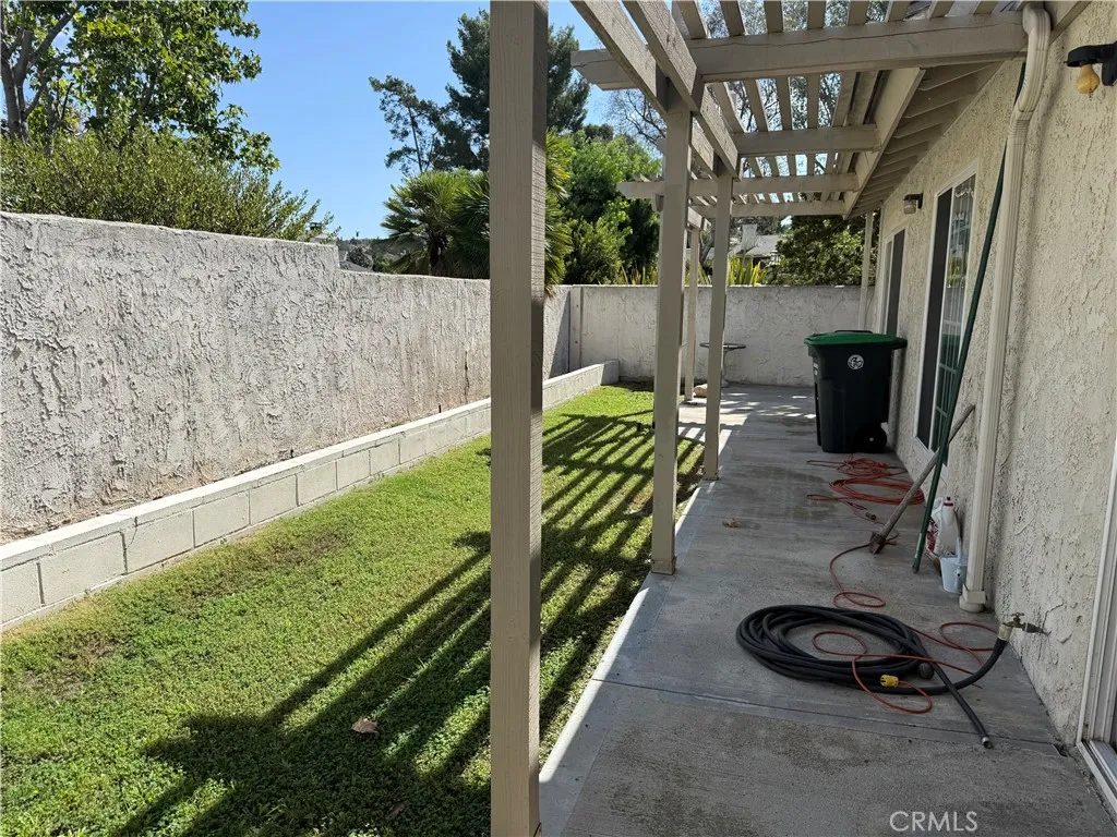 Good use of backyard with planters and grass Good use of backyard with planters and grass
