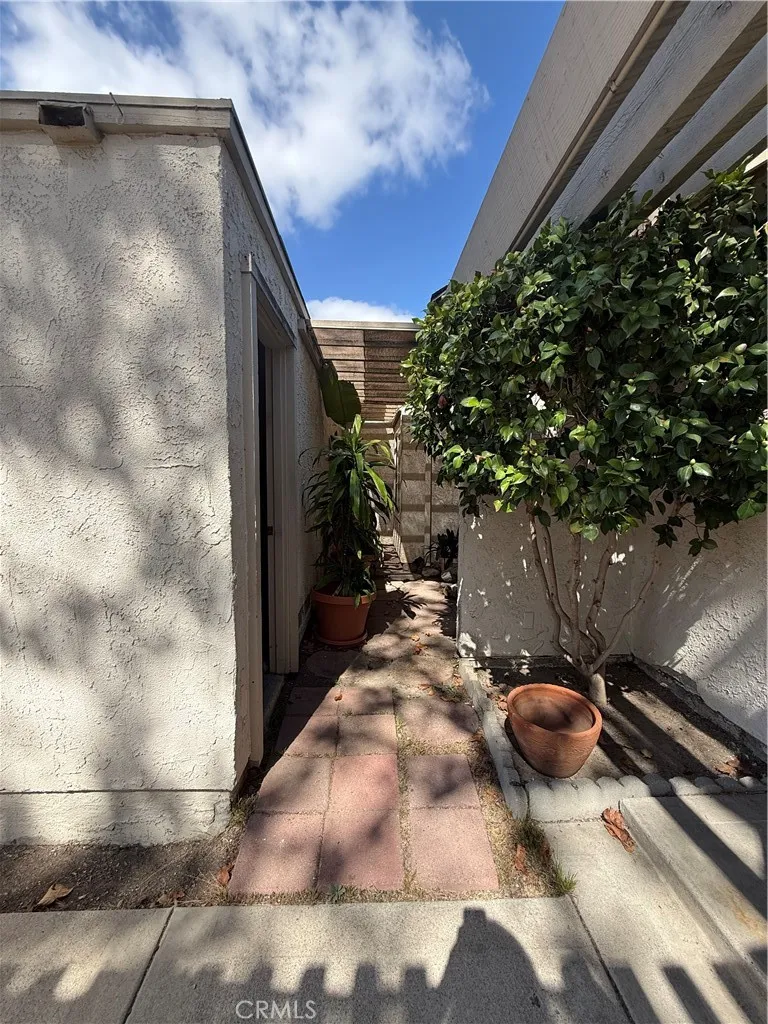 Paved area between garage and primary bedroom. Paved area between garage and primary bedroom.
