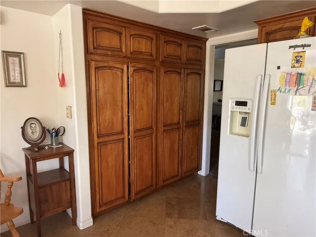 Wall to wall kitchen cabinets for extra storage. Wall to wall kitchen cabinets for extra storage.