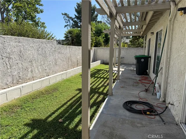 Good use of backyard with planters and grass