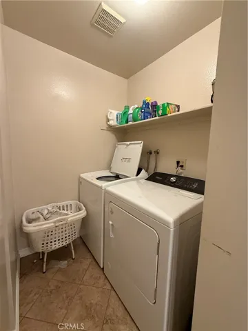 Laundry accessible from shared bathroom.