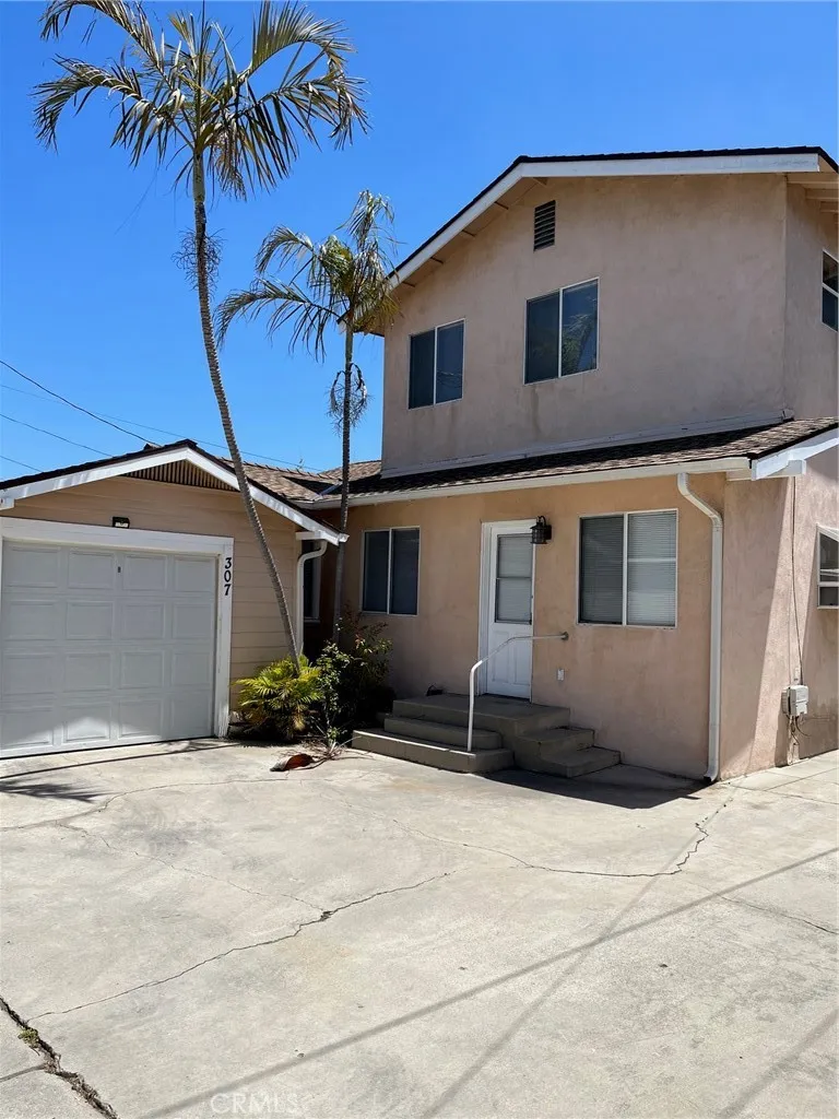 View of backdoor and garage