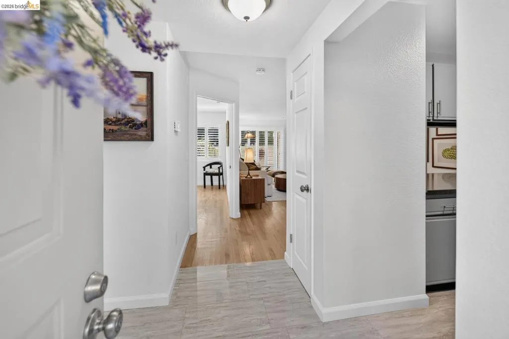 Entrance with light-toned tile flooring and white trim Entrance with light-toned tile flooring and white trim