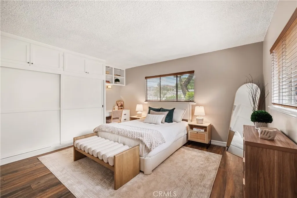 Spacious Primary bedroom offers a comfortable retreat with natural light and ample room for additional furniture.
Spacious Primary bedroom offers a comfortable retreat with natural light and ample room for additional furniture.