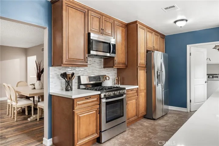 Additional kitchen view highlights abundant storage, functional workspace and easy connection to the surrounding living areas
