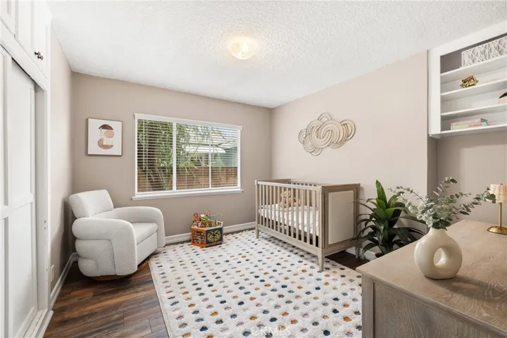 Additional bedroom with built-in storage and workspace offers excellent flexibility for a bedroom, office or study area.