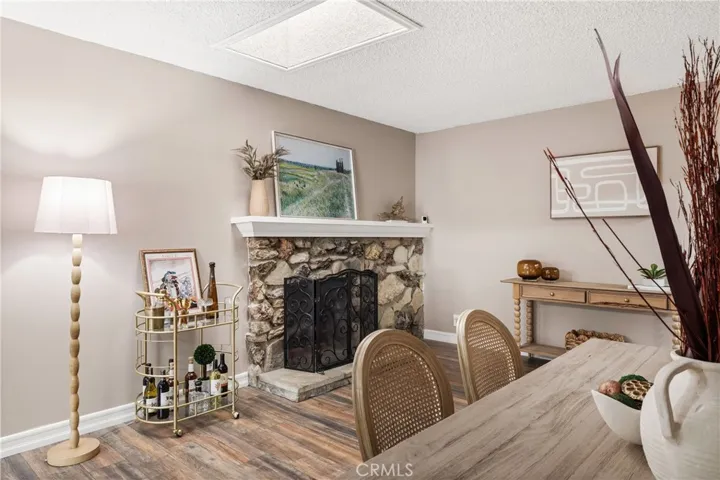 Cozy fireplace adds warmth and character to the home’s generous living and entertaining space.
