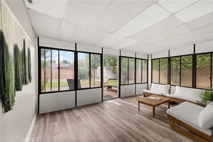 Light-filled enclosed patio/sunroom extends the usable living space and offers views of the backyard.