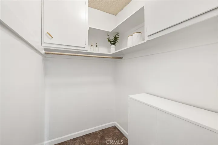 Walk-in pantry/storage area provides valuable additional space for groceries, kitchen essentials and household organization.