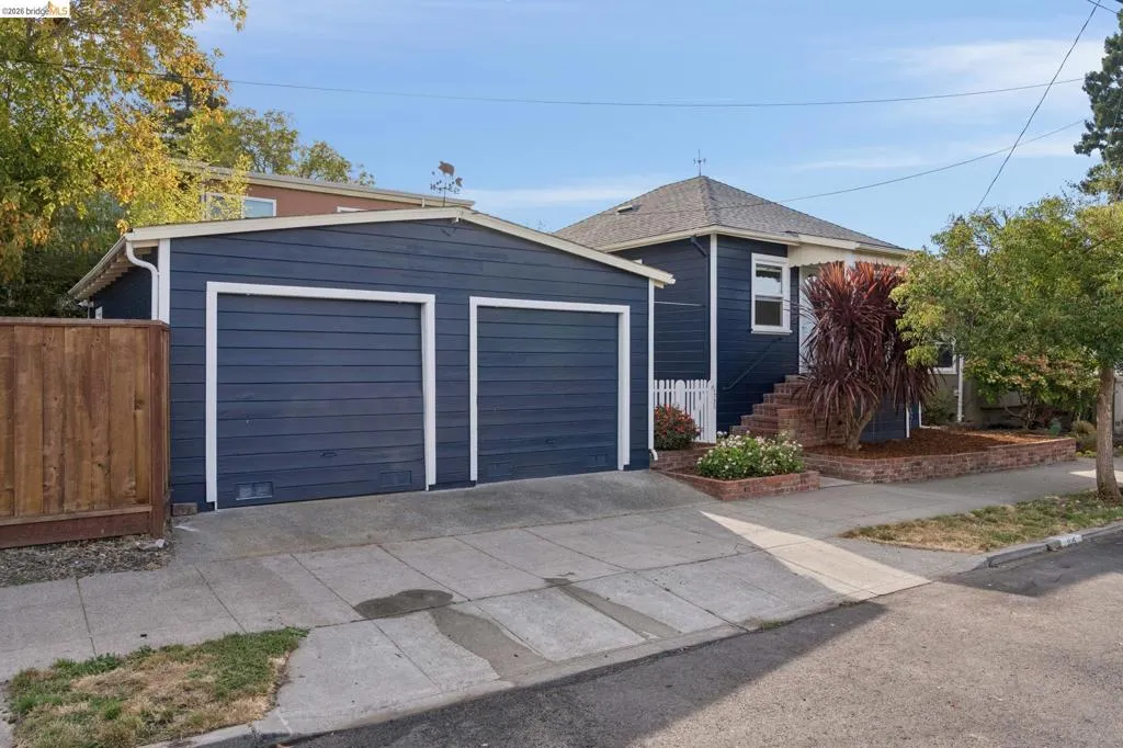 Siding exterior with multiple windows and a two-car garage