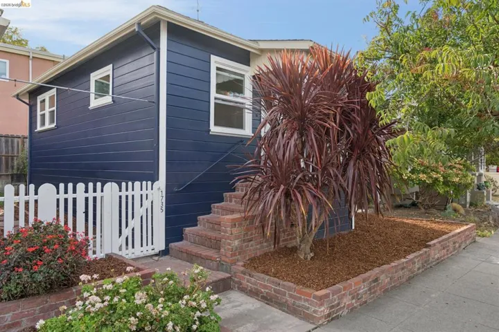 Dark blue horizontal siding with white trim