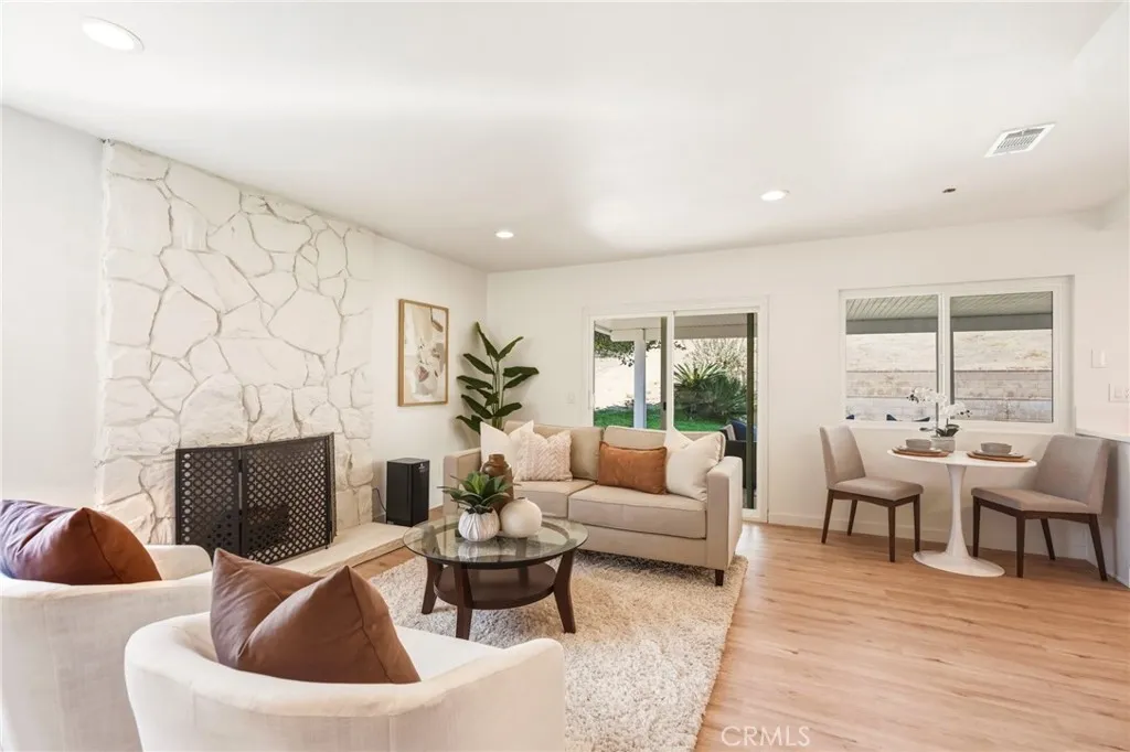 Family room with a stone fireplace