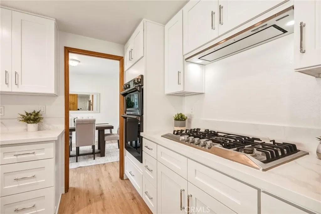 Empava cooktop with Italian-made burners, an externally vented hood, and ~$10k of SMART Samsung APPLIANCES (wall oven/microwave, refrigerator, and dishwasher)
