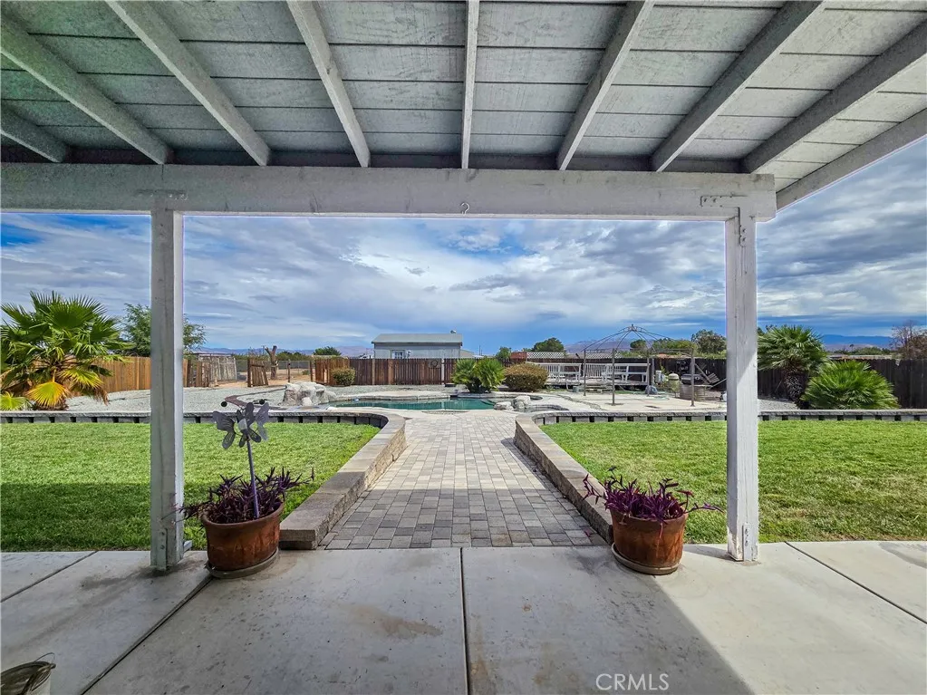 Covered patio overlooking backyard