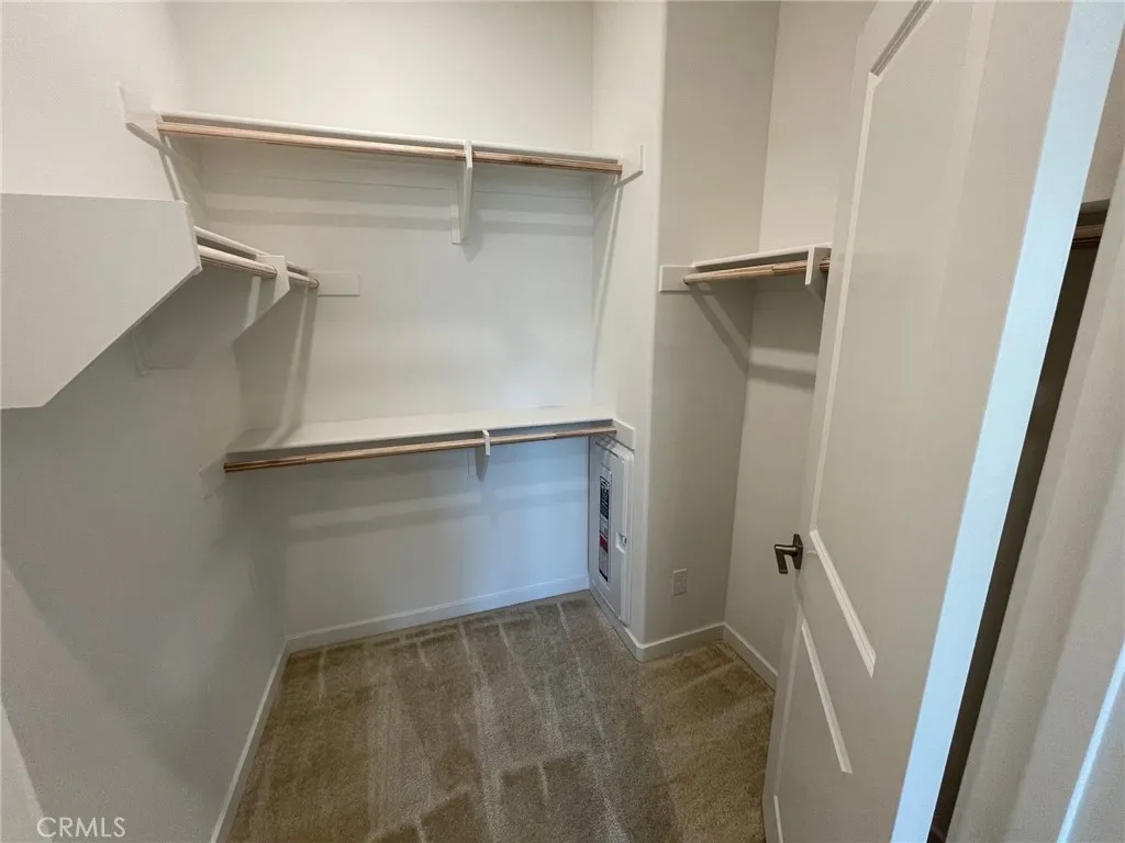 Primary Walk-In Closet Primary Walk-In Closet