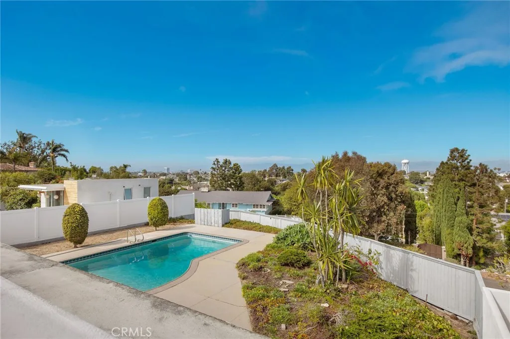 View of pool and patio below