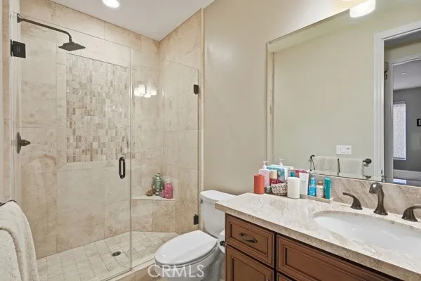 Private ground-level bathroom featuring a spacious walk-in shower with elegant tilework.