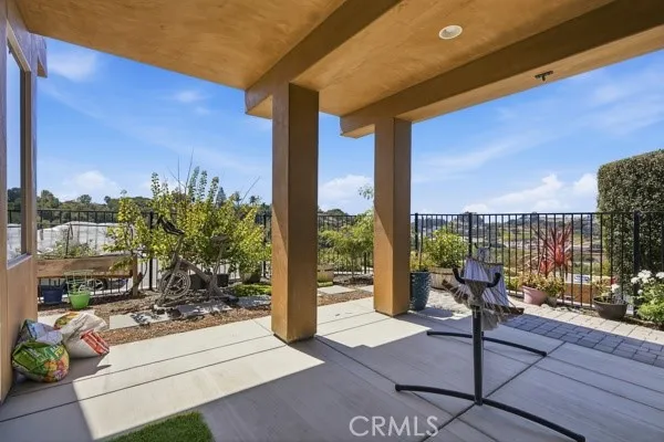 The private covered patio extends the family room's living space, creating a seamless indoor-outdoor retreat.