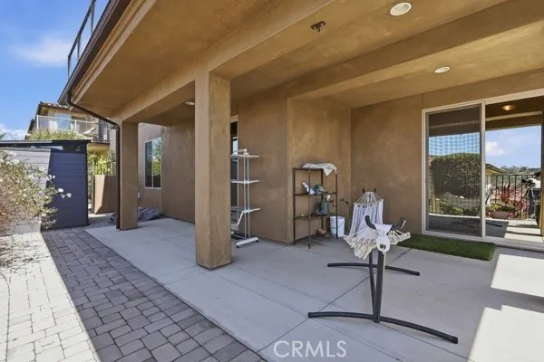 Covered ground-level pation with ocean and hillside views, plus water, gas, and electrical hookups ready for a hot tub or outdoor​​‌​​​​‌​​‌‌​​‌​​​‌‌​​​‌​​‌‌​​‌‌​​‌‌​​​​ kitchen.