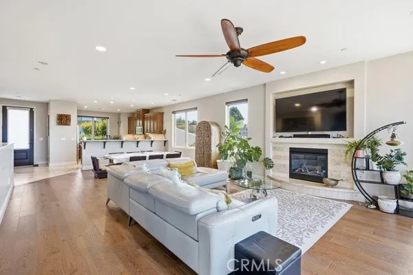 Expansive open-concept living space with a cozy fireplace.