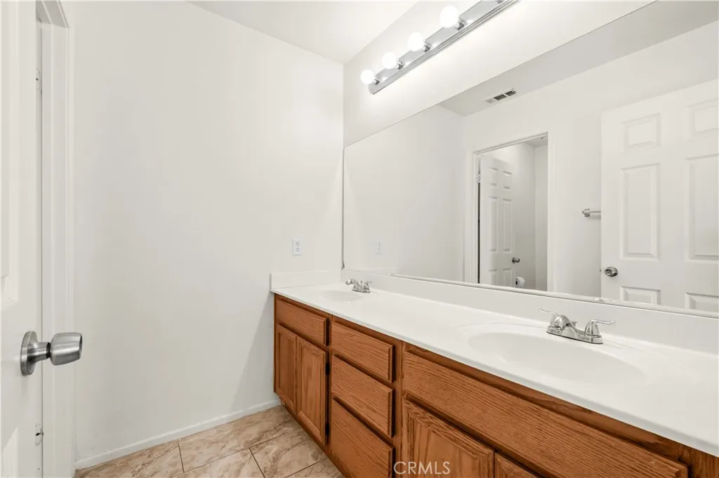 Full bathroo with dual sinks Full bathroo with dual sinks