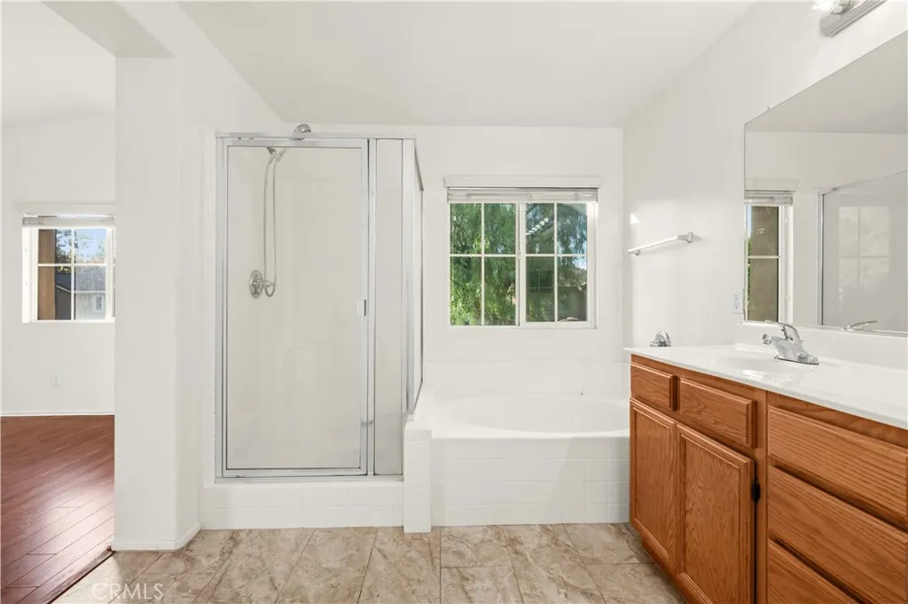 Primary bathroom with dual sinks, walk-in shower and tub Primary bathroom with dual sinks, walk-in shower and tub