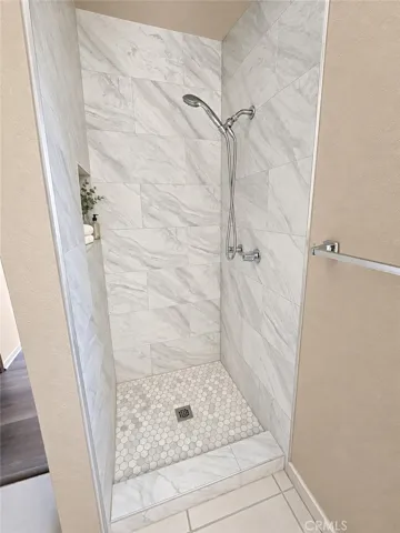 Upstairs Hall Shower - Photos have used AI for brightness and staging.