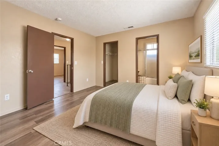 Master Bedroom w/Ensuite Bathroom. Photos have used AI for brightness and staging.