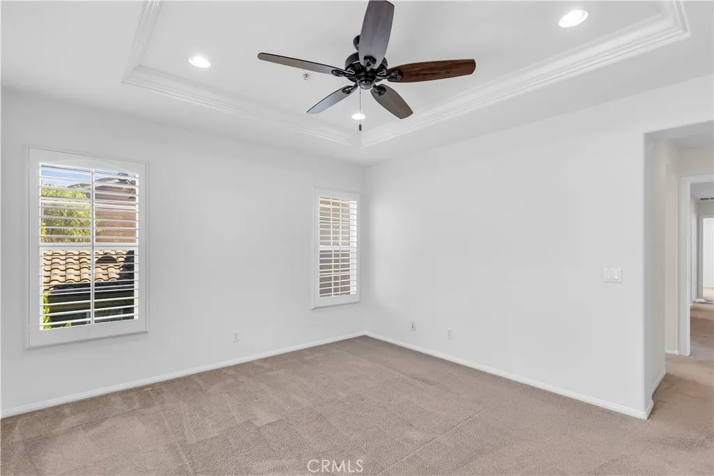 Master bedroom with plantation shutters, recessed lighting, ceiling fan Master bedroom with plantation shutters, recessed lighting, ceiling fan