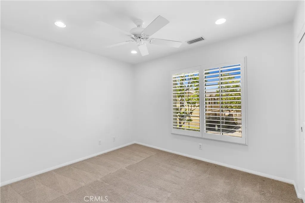 Upstairs bedroom with recessed lighting + ceiling fan Upstairs bedroom with recessed lighting + ceiling fan