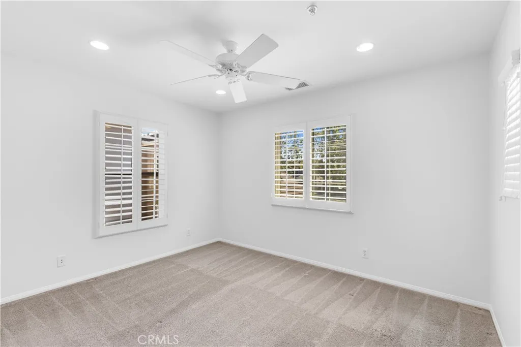 Upstairs bedroom with recessed lighting + ceiling fan Upstairs bedroom with recessed lighting + ceiling fan