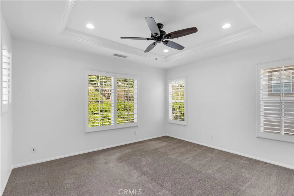 Master bedroom with plantation shutters, recessed lighting, ceiling fan Master bedroom with plantation shutters, recessed lighting, ceiling fan