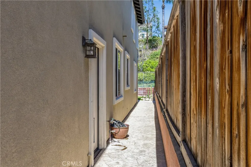 Pathway behind home wraps around past garage to side fence Pathway behind home wraps around past garage to side fence