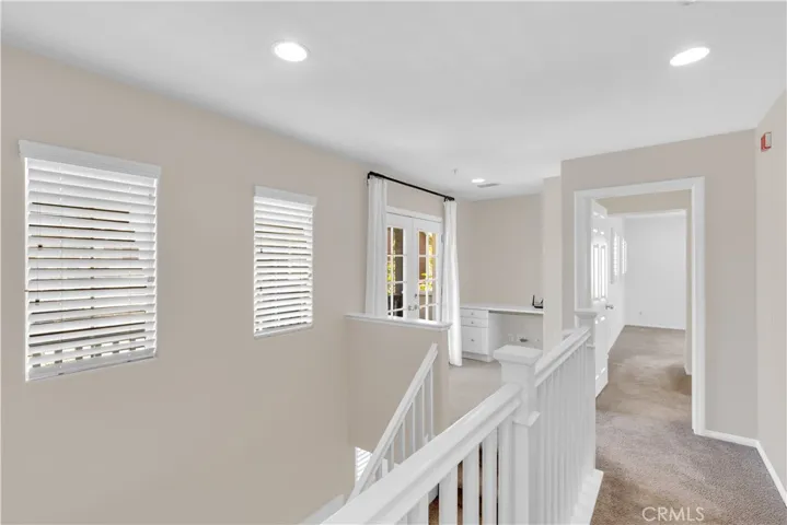 Built-in study/office space opens to front balcony