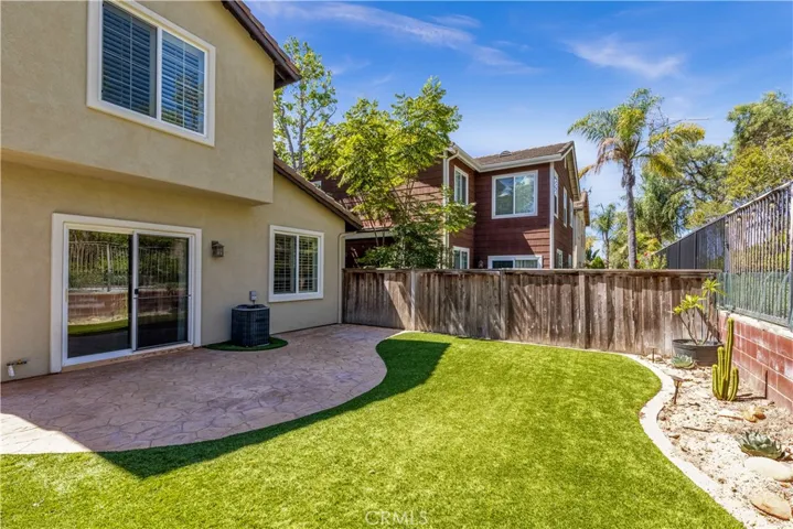 Private, low maintenance backyard with turf.