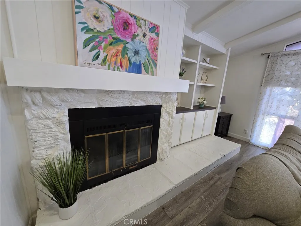 Fireplace and built in shelves in living room