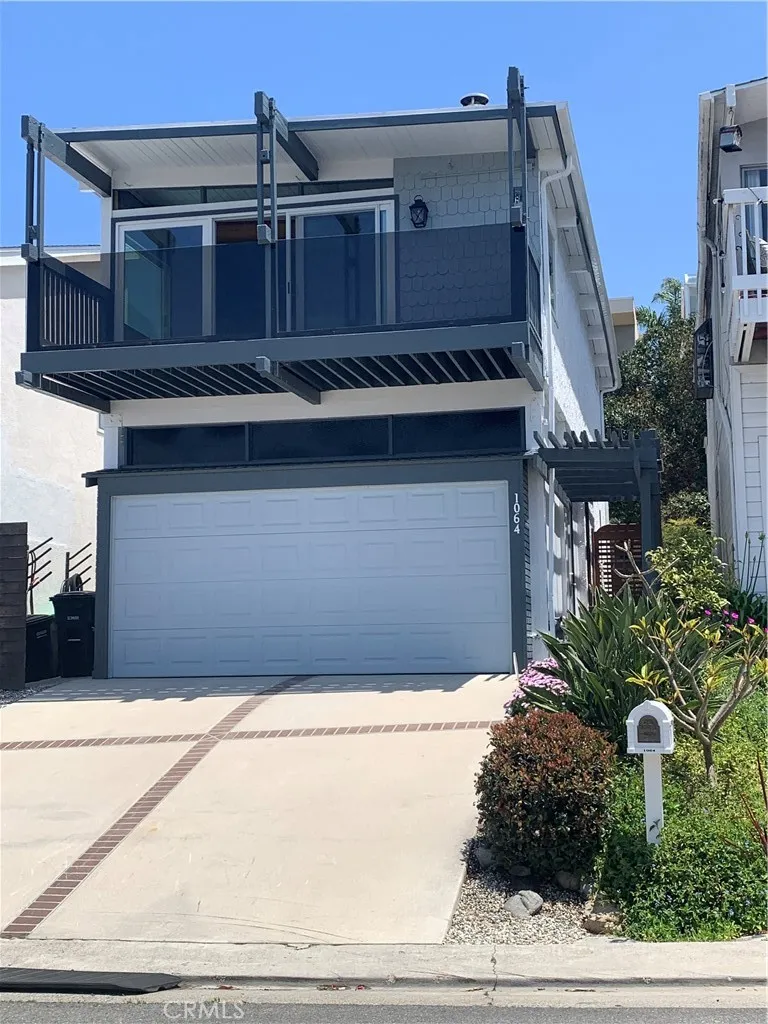 Front view shows large deck off main living area to enjoy your views