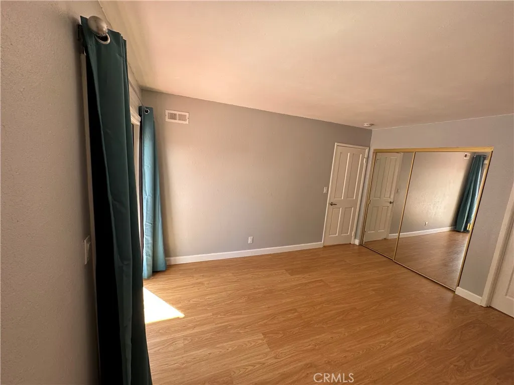 Downstairs with main level bedroom opens up to backyard