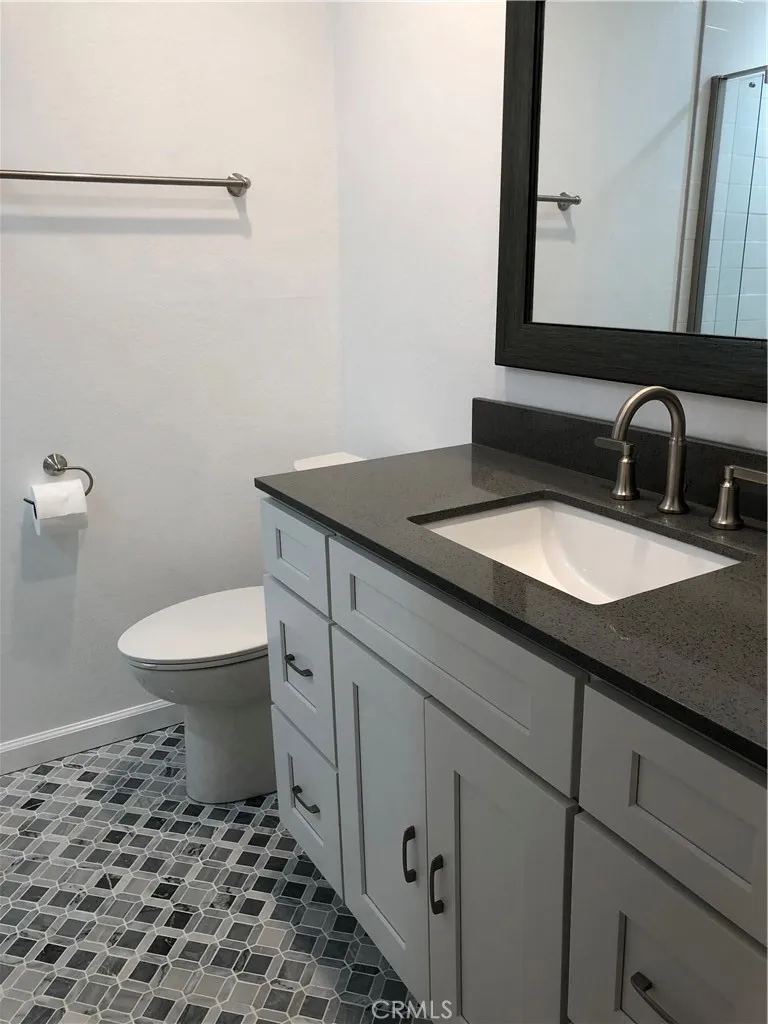 Main level bathroom with beautiful flooring tile work